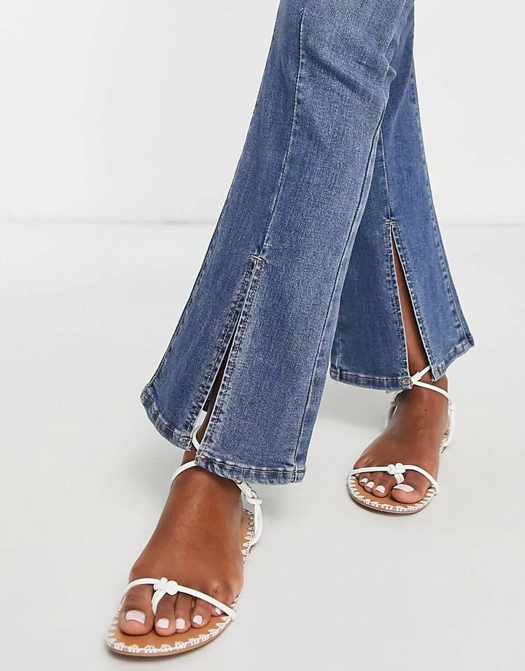 Urban Revivo Flare Jeans With Front Split In Mid Blue For Women 5 Urban Revivo Flare Jeans With Front Split In Mid Blue For Women - Image 3